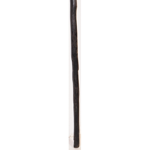 173 - A 20th Century vintage Africa tribal barbed fishing spear. Lacquered wood with a pointed tip, string... 