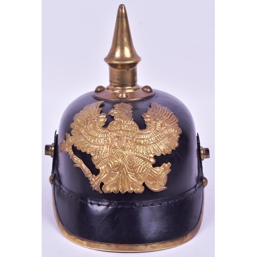 199 - A reproduction WWI First World War Imperial German / Prussian Army 1860 pattern pickelhaube helmet.
... 