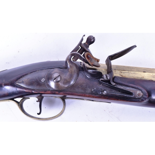 21 - An 18th Century Moore of London made flintlock brass barrelled blunderbuss pistol. The lock plate fa... 