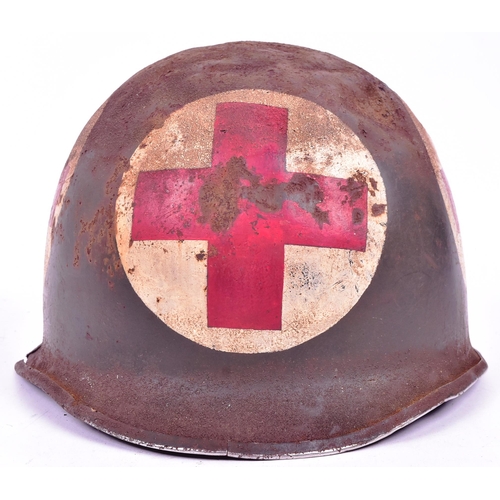 210 - An original WWII Second World War US United States Army M1 Medics helmet. Steel outer shell with swi... 