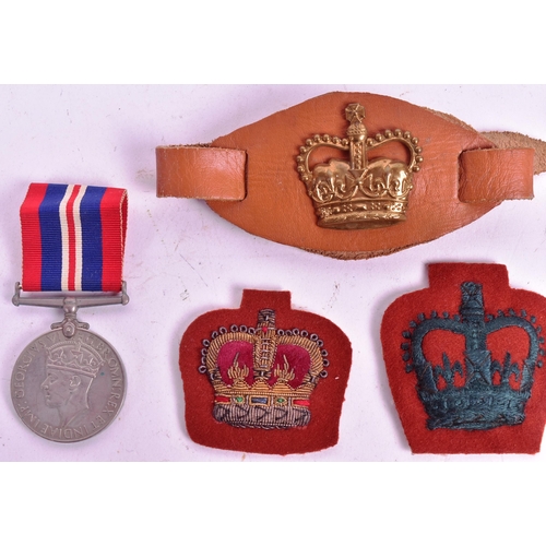 214 - A collection of assorted Military badges and medals to include a WWI First World War French Lalique ... 