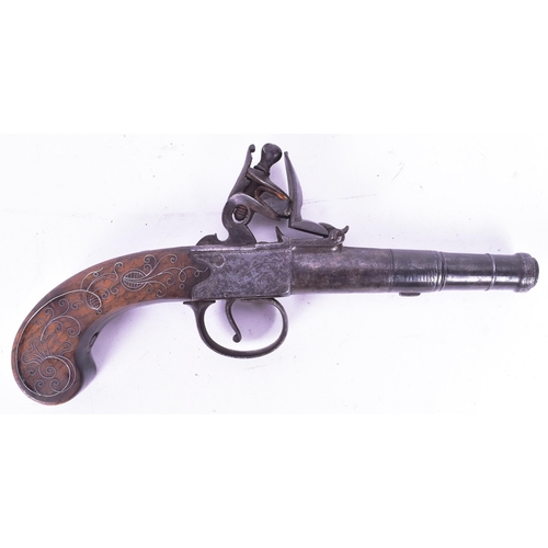 22 - An 18th Century T Smith of Worcester made flintlock pocket pistol. Cannon barrel, foliate engraved l... 