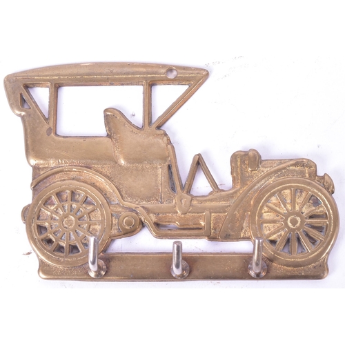 226 - A collection of assorted automobile and other interest brass items comprising x2 circa 1920s Powell ... 