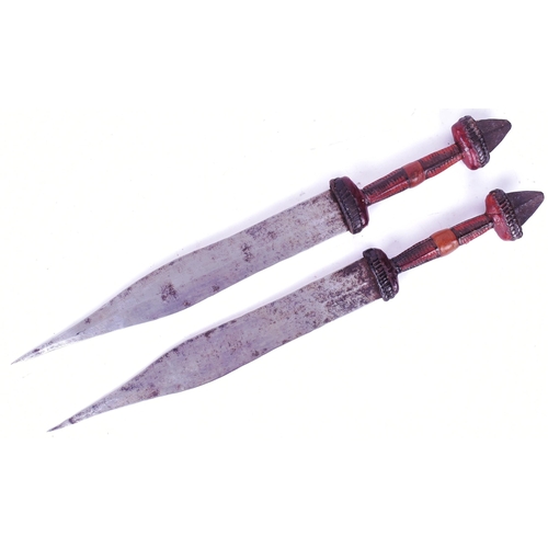 229 - A pair of African Central Sahara (Chad) Tubu People tribal daggers. Exposed metal pommels, plaited l... 