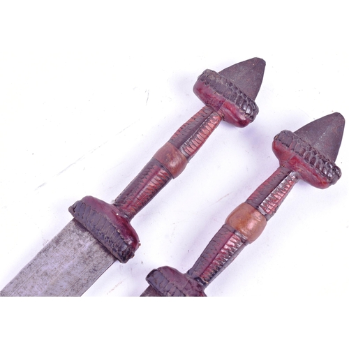 229 - A pair of African Central Sahara (Chad) Tubu People tribal daggers. Exposed metal pommels, plaited l... 