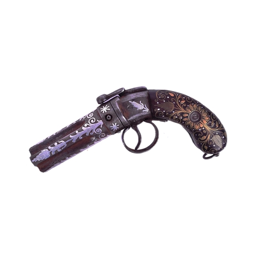 23 - An early 20th Century Indian Pepper Box Pistol / multi barrel revolver. The butt inlaid with brass s... 