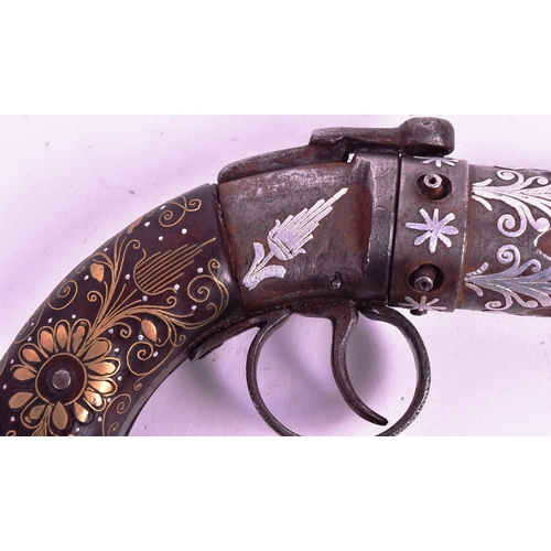 23 - An early 20th Century Indian Pepper Box Pistol / multi barrel revolver. The butt inlaid with brass s... 