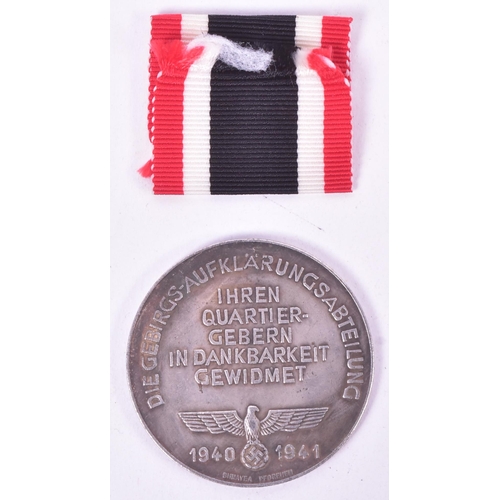 252 - A WWII Second World War Third Reich Nazi German style Mountain Troop (Gebirgsjager) medallion depict... 