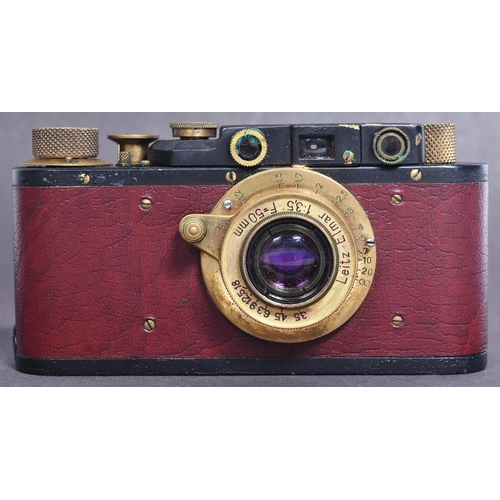 255 - A WWII Second World War Third Reich Nazi German Luftwaffe style Leica made camera within a brown lea... 