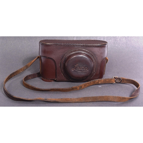 255 - A WWII Second World War Third Reich Nazi German Luftwaffe style Leica made camera within a brown lea... 