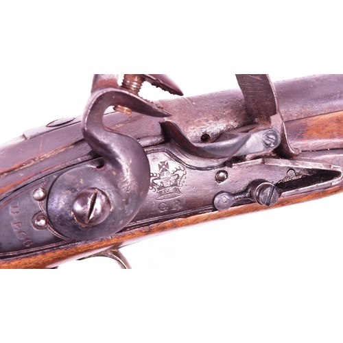 27 - An 18th Century Durs Egg of London made flintlock pistol. Brass mounted walnut stock with an oval lo... 