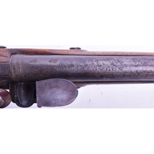 27 - An 18th Century Durs Egg of London made flintlock pistol. Brass mounted walnut stock with an oval lo... 