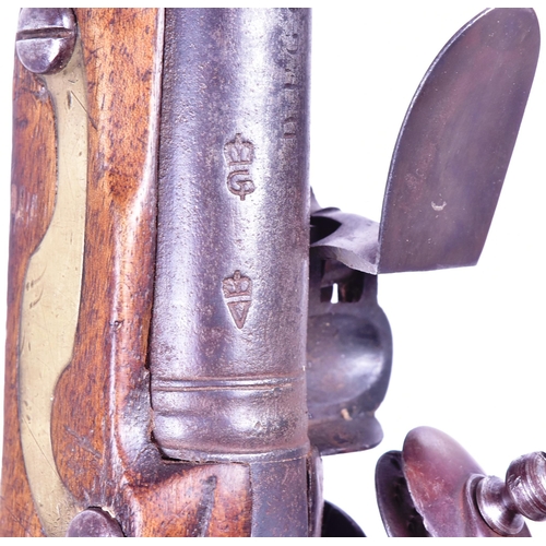 27 - An 18th Century Durs Egg of London made flintlock pistol. Brass mounted walnut stock with an oval lo... 