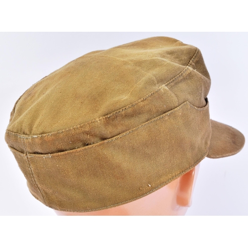 277 - A WWII Second World War Third Reich Nazi German Waffen SS forage cap. Khaki with an applied skull an... 