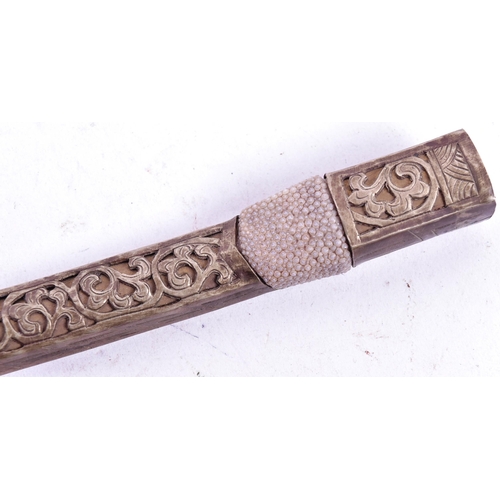 316 - A 19th Century Tibetan / Bhutanese ladies belt knife. Bone handle secured to the tang with rivets, c... 