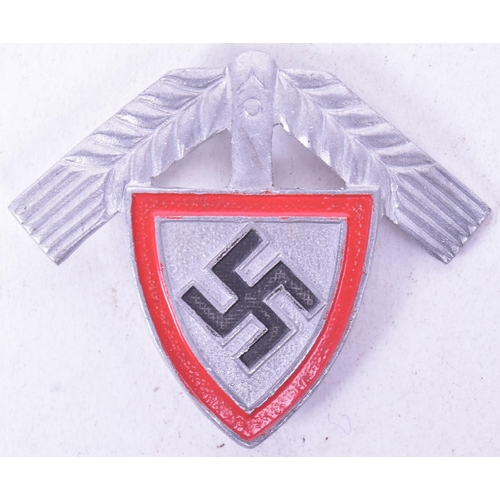 322 - A WWII Second World War Third Reich Nazi German RAD Labour Corps cap badge depicting a Swastika betw... 