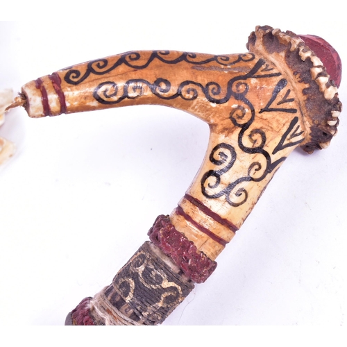 34 - A Malayan ( Borneo ) Dayak People Head Hunters Mandau knife. Hooked horn shaped grip with black inke... 