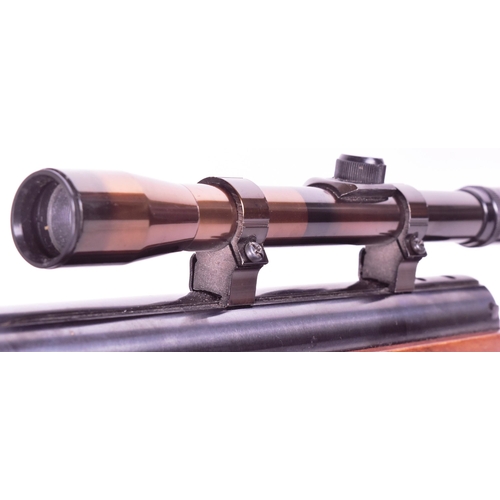 340 - An original German Weihrauch made .22 calibre under-lever air rifle model No. HW97K. Chequered semi-... 