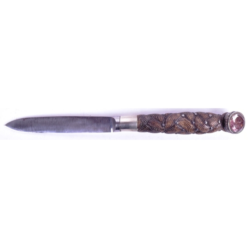 35 - An early 20th Century Scottish Highlanders ceremonial dirk. Faceted glass top pommel, carved basket ... 