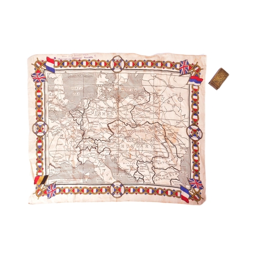 377 - A WWI First World War period Manchester Guardian Readers cloth map of Europe along with a brass Batt... 