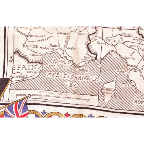 377 - A WWI First World War period Manchester Guardian Readers cloth map of Europe along with a brass Batt... 