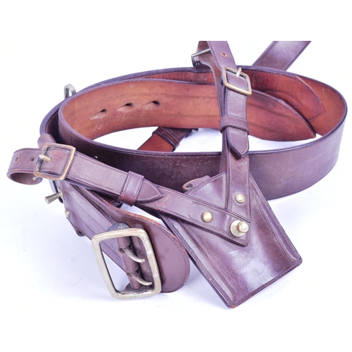 378 - Two original British Military Sam Browne officers uniform belts. Leather construction with chest str... 