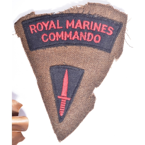 390 - A collection of WWII Second World War British RM Royal Marines items comprising a beret, tunic shoul... 