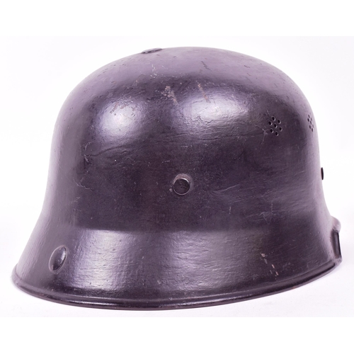 391 - A WWII Second World War Third Reich Nazi German factory workers fire helmet. Black with two sets of ... 