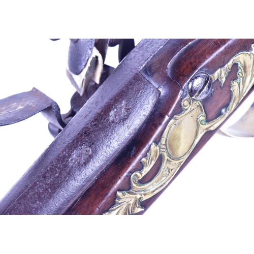 42 - An 18th Century Ketland of Birmingham made flintlock pistol. Rounded wooden butt with engraved brass... 