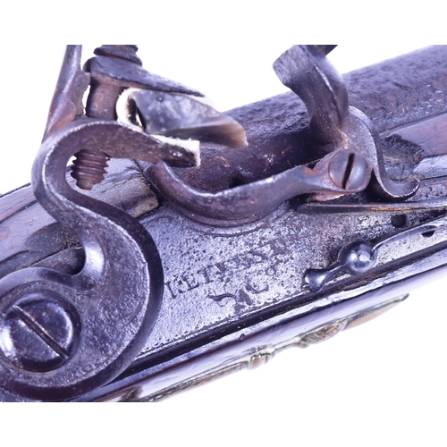 42 - An 18th Century Ketland of Birmingham made flintlock pistol. Rounded wooden butt with engraved brass... 