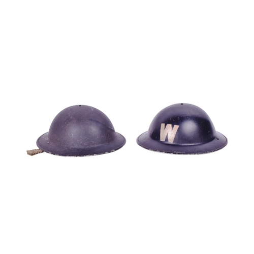 429 - Two WWII Second World War British steel combat Brodie helmets. One painted with a white ' W ' for wa... 