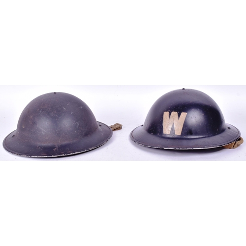 429 - Two WWII Second World War British steel combat Brodie helmets. One painted with a white ' W ' for wa... 