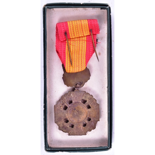 52 - Vietnam War - a South Vietnam Gallantry Cross medal. Celtic cross with two crossed swords with a cen... 