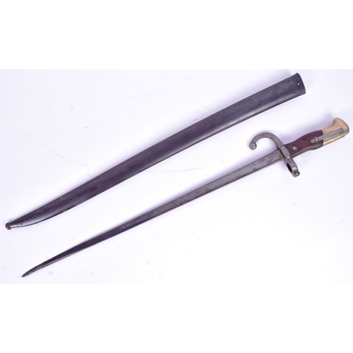 67 - An original 19th Century French 1881 pattern Gras rifle bayonet. The hilt with brass pommel and wood... 