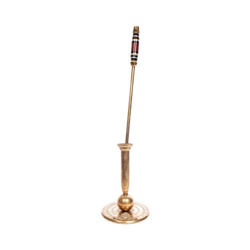 91 - An interesting brass fireside fire poker attributed to the Royal Artillery. Brass circular base with... 