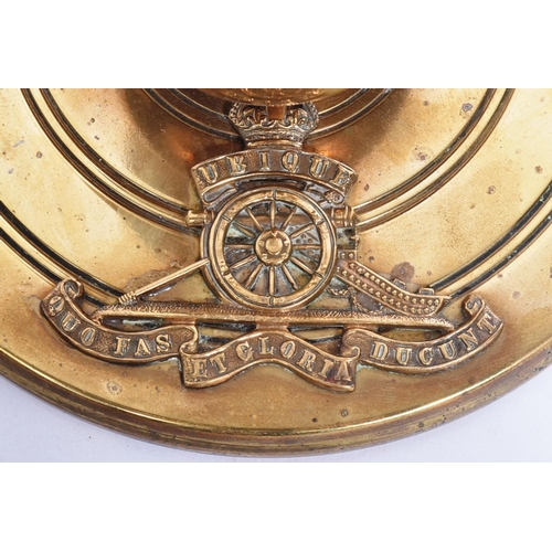 91 - An interesting brass fireside fire poker attributed to the Royal Artillery. Brass circular base with... 