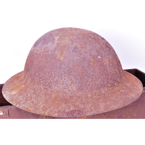 93 - A collection of militaria comprising x2 British WWII Second World War helmets ( Brodie and Zuckerman... 