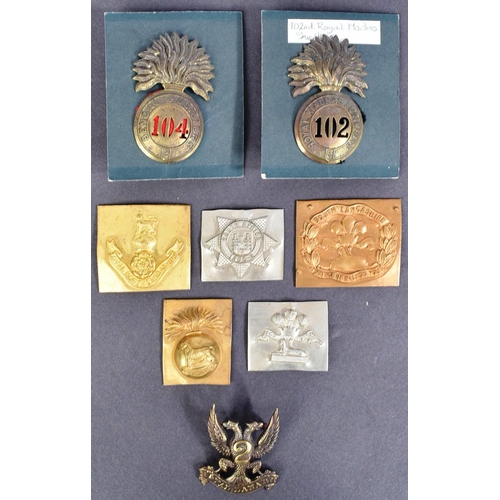 96 - A collection of assorted British Military cap badges along with some uncut examples to include; Roya... 