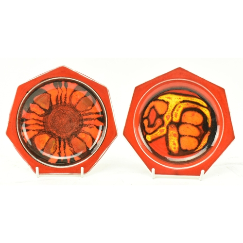 103 - Poole Pottery - Delphis - A collection of four retro 20th century hand painted trinket plates. Two h... 