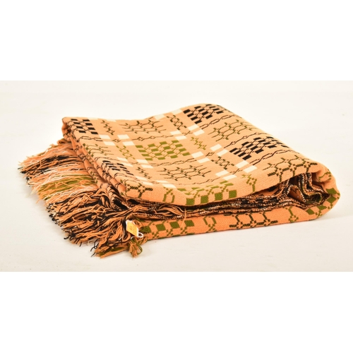 106 - A vintage 20th century hand made woollen traditional Welsh blanket. Meadow green, cream and orange g... 