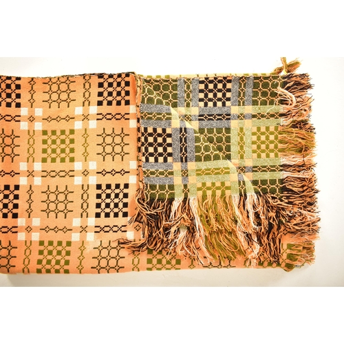 106 - A vintage 20th century hand made woollen traditional Welsh blanket. Meadow green, cream and orange g... 