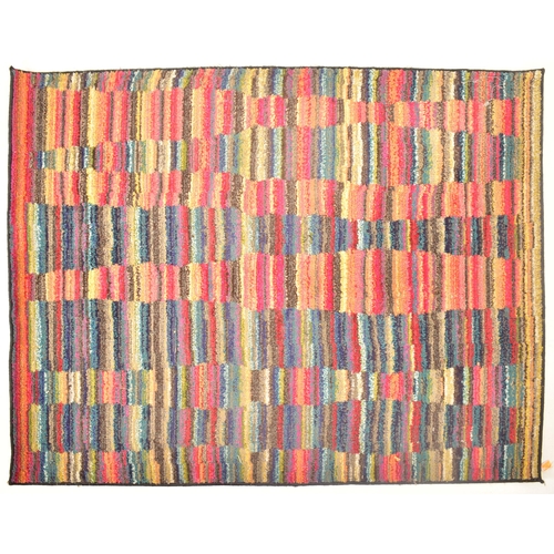 123 - A late 20th century multi coloured woollen floor carpet rug. The rug of rectangular form with multi ... 