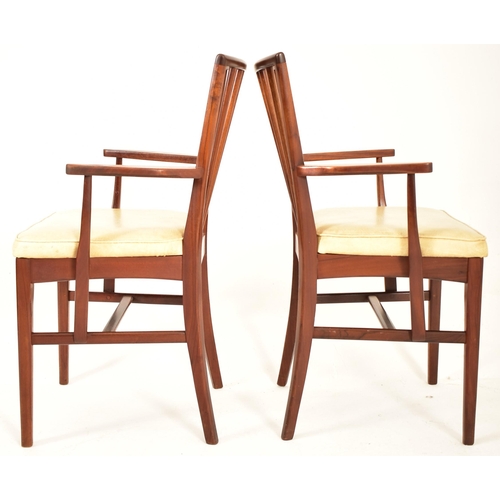 129 - Youngers - A retro 20th century 1970s British design teak dining table and six chairs (two carvers).... 