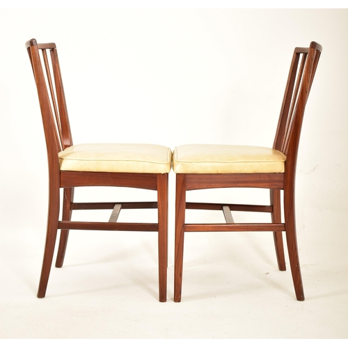 129 - Youngers - A retro 20th century 1970s British design teak dining table and six chairs (two carvers).... 