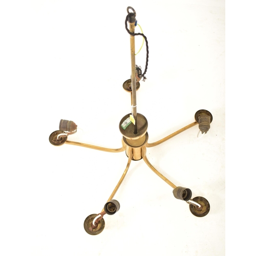136 - A retro 20th century designer five branch hanging chandelier. The chandelier of brass construction h... 