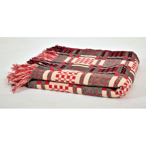 14 - A vintage 20th century hand made woollen traditional Welsh blanket. Red, cream, black and grey groun... 