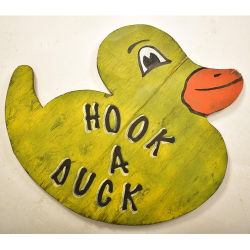 159 - Hook A Duck - A vintage 20th century fairground / funfair hand painted sign in the form of duck. The... 