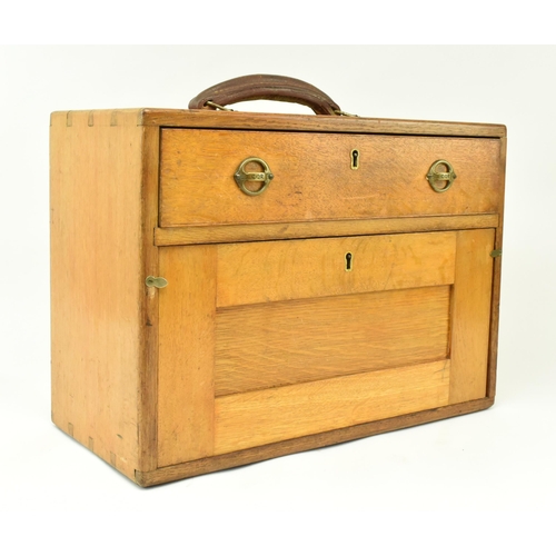 17 - A retro 20th century CQR oak engineers / workman's tool chest. The chest having a leather handle to ... 