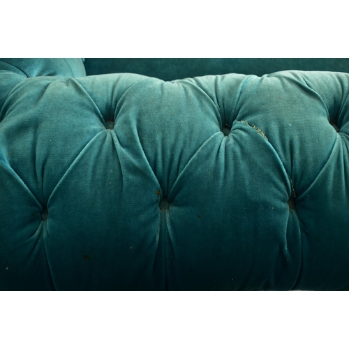 177 - An early 20th century re-upholstered chesterfield three seater sofa settee. The sofa having a scroll... 