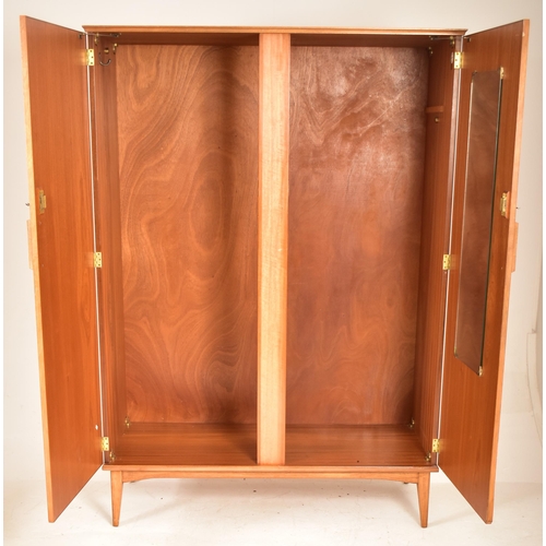 193 - Alfred Cox for AC Furniture - A mid 20th century walnut double door wardrobe / stand alone closet. T... 